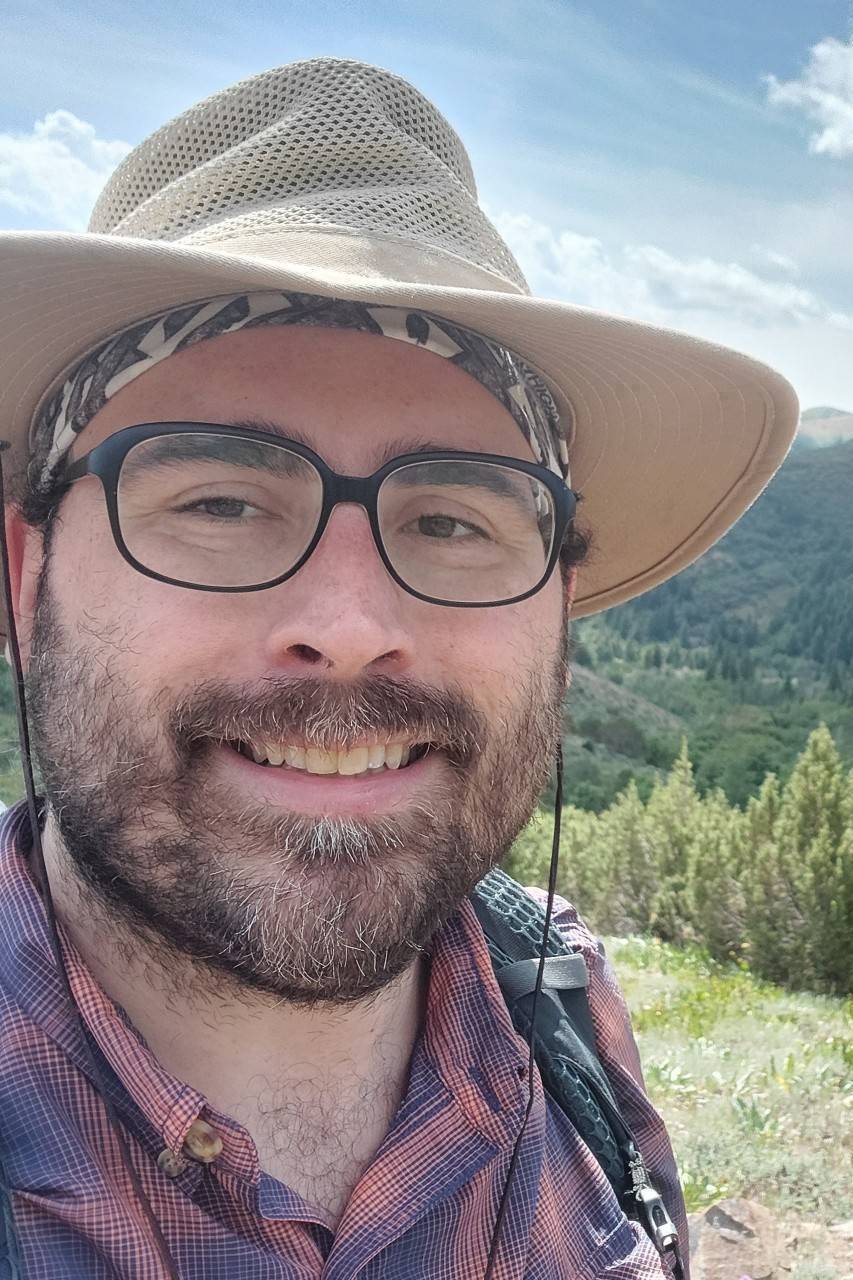 Robert Ramos selfie against a grassy field