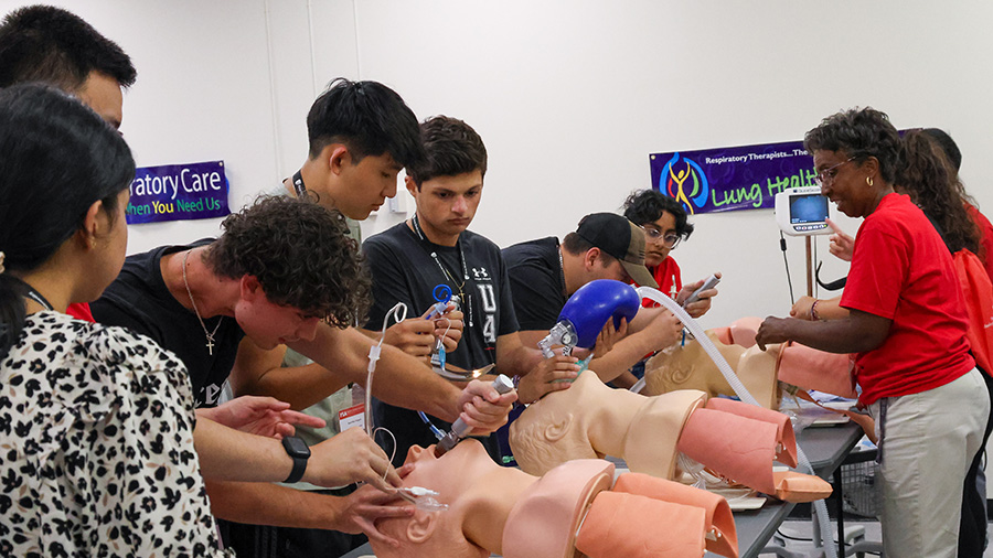 Students practicing on patient dummy