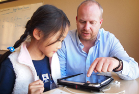 Student and teacher on iPad